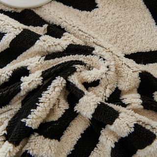 Copridivano in peluche con motivo geometrico